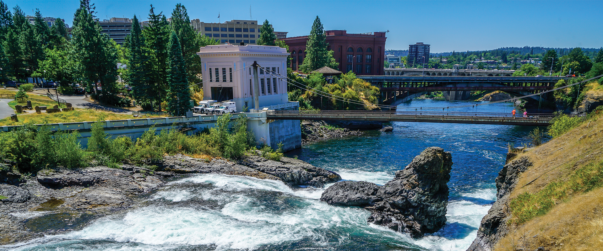 A river and bridges next to city buildings in Washington State